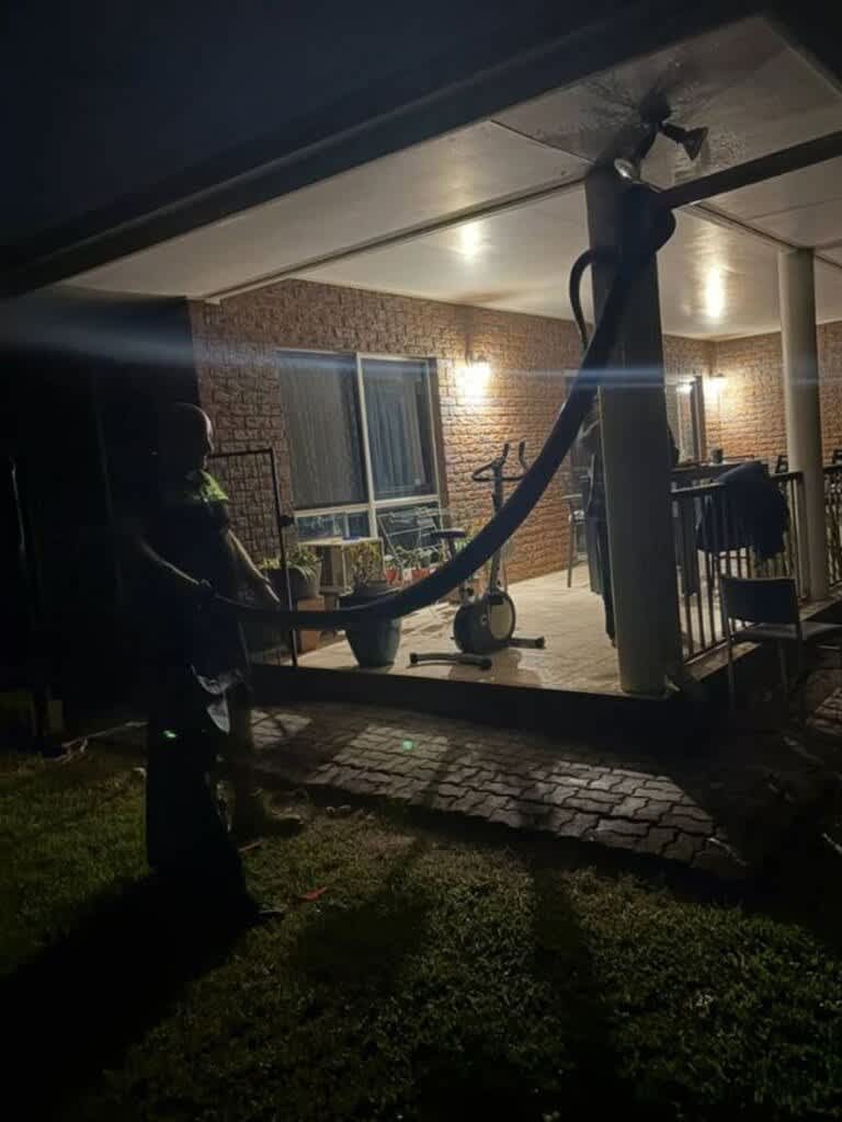 aussie-dad-discovers-massive-26kg-python-in-his-yard