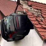 car-crashes-into-barn-roof-in-germany-two-seriously-injured