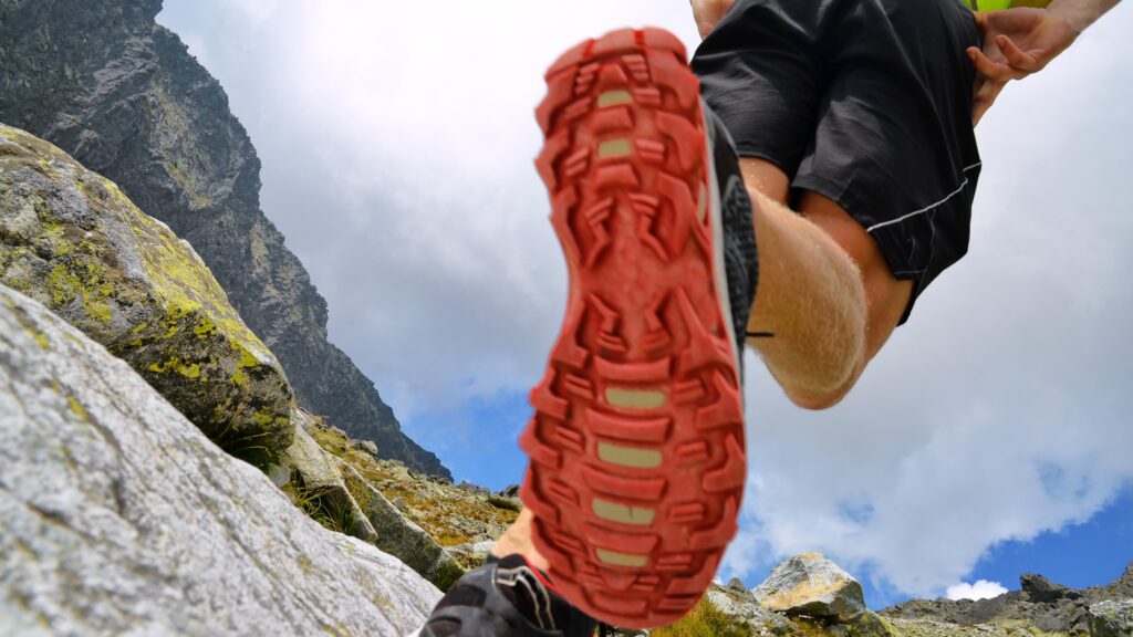 Hiking,,Running,Tourist,In,Mountains,-,Red,Sole,On,Shoes,