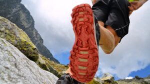 Hiking,,Running,Tourist,In,Mountains,-,Red,Sole,On,Shoes,
