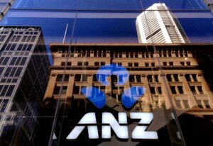 FILE PHOTO: The logo of the ANZ Banking Group is displayed in the window of a newly opened branch in central Sydney, Australia