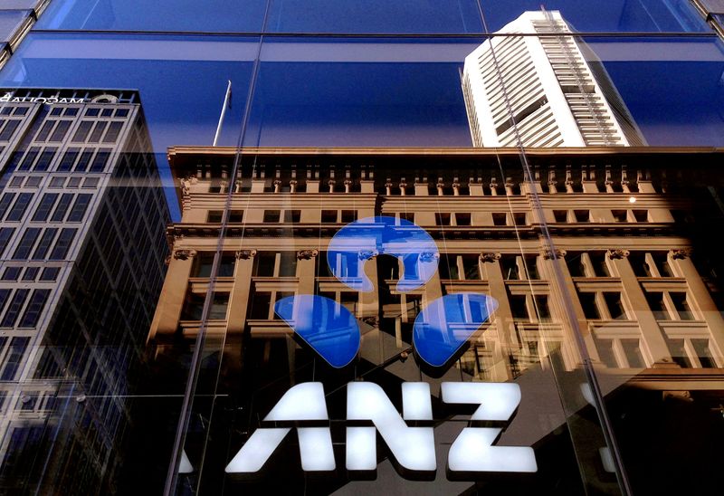 FILE PHOTO: The logo of the ANZ Banking Group is displayed in the window of a newly opened branch in central Sydney, Australia