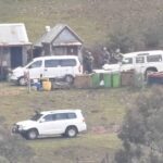 man-charged-with-gun-drug-offences-amid-ongoing-manhunt
