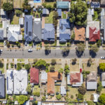 Aerial view directly above established houses in older Adelaide southern suburb
