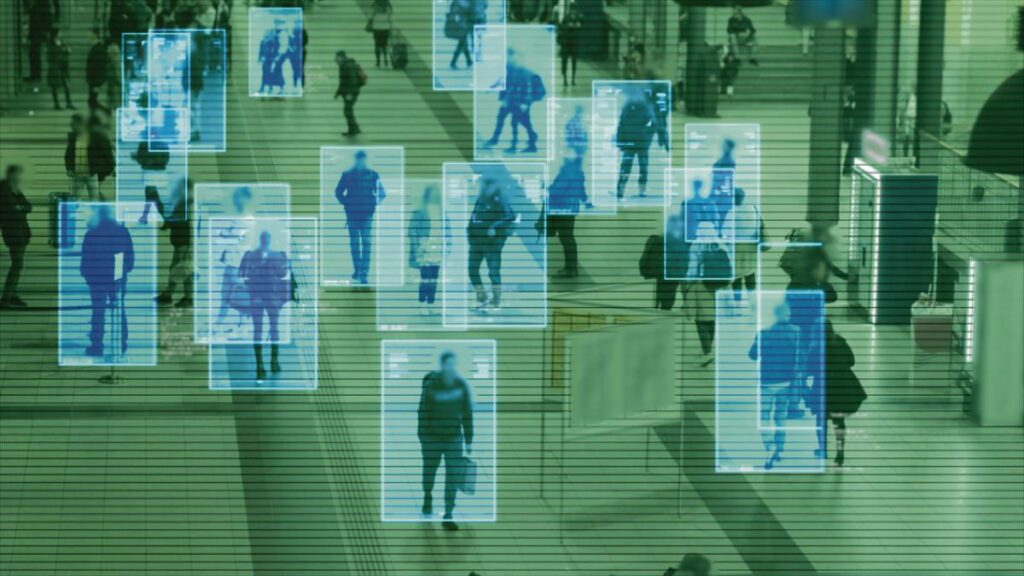 Scanning the crowd of people walking at the railway station. Sur