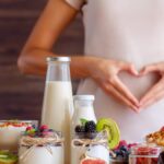 Female make shape of heart with her hands. Light summer breakfas