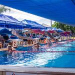 Swimmers dive into the pool at the Kimberley Open Short Course.