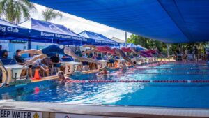 Swimmers dive into the pool at the Kimberley Open Short Course.