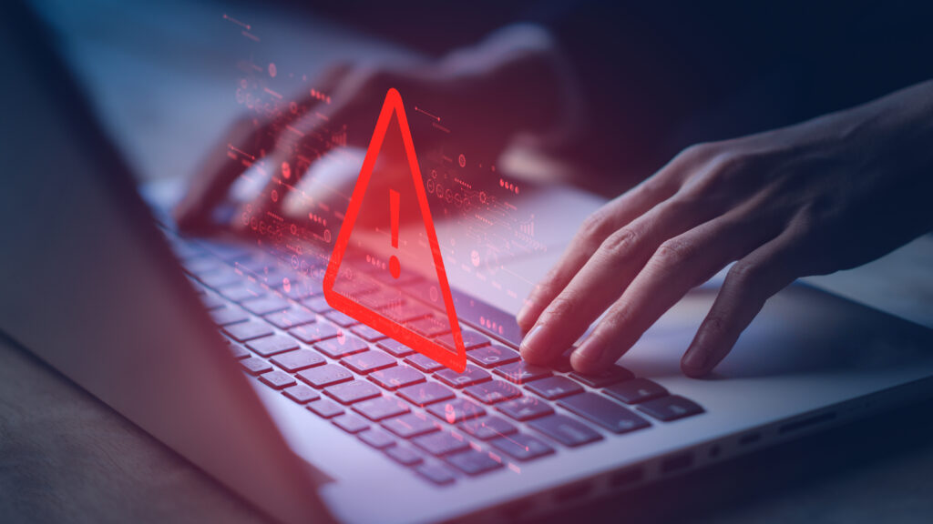 System hacked warning alert on notebook (Laptop). Cyber attack on computer network, Virus, Spyware, Malware or Malicious software. Cyber security and cybercrime. Compromised information internet.
