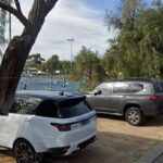 Multiple vehicles use the verge on Bay View.