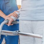 Cropped,Image,Of,Nurse,Helping,Senior,Woman,To,Walk,With
