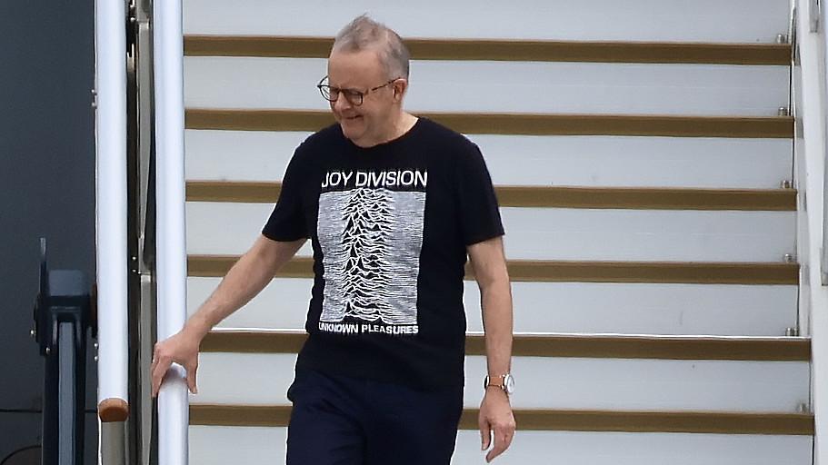 EXCLUSIVE Jet Lag & Joy Division for Albo! Australia’s Prime Minister returned home post-Trump looking more rock ’n’ roll than political — swapping power suits for post-punk style on the tarmac.