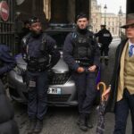 mystery-surrounds-fedora-man-after-louvre-heist-snapshot