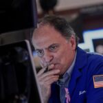 wall-street-dips-amid-ai-valuation-concerns-shutdown-developments