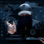 Cyber Hacker with Laptop and Digital HUD Interface