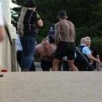 tensions-rise-as-armed-men-appear-at-bondi-beach