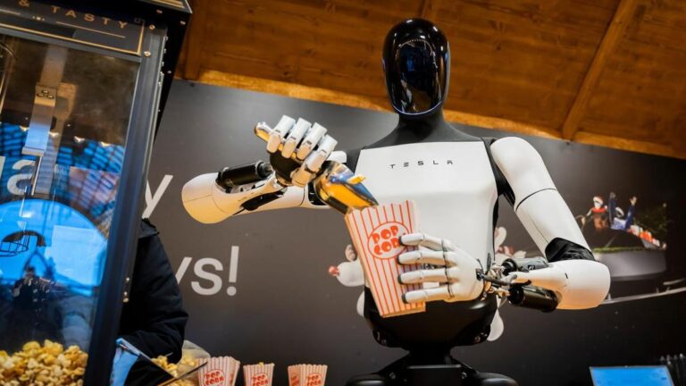 tesla-s-optimus-robot-dazzles-berlin-hands-out-popcorn-today-