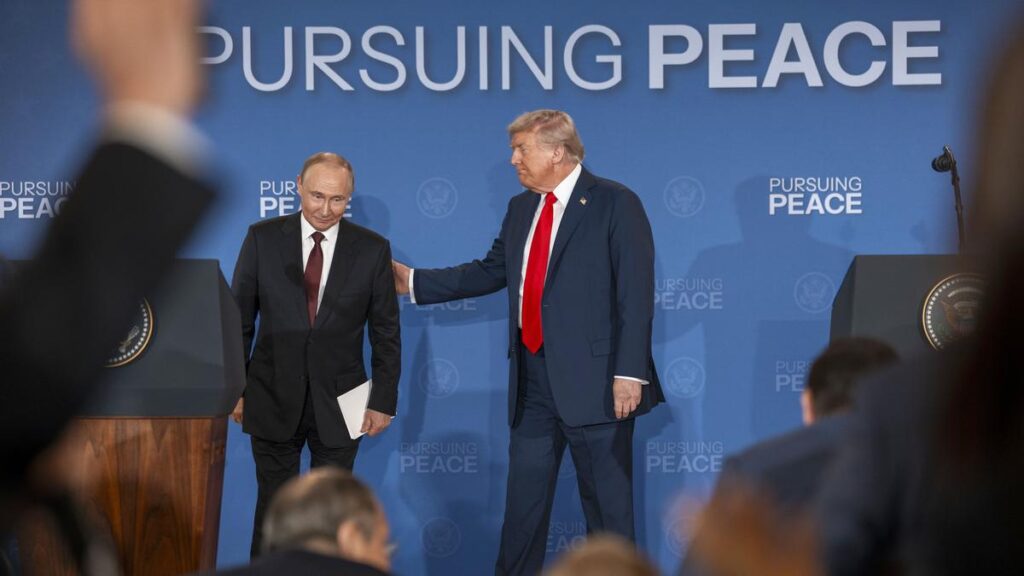 Russian President Vladimir Putin and President Donald Trump begin to leave the stage after making statements following their meeting in Anchorage, Alaska, Aug. 15, 2025. (Doug Mills/The New York Times)