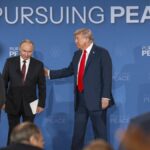Russian President Vladimir Putin and President Donald Trump begin to leave the stage after making statements following their meeting in Anchorage, Alaska, Aug. 15, 2025. (Doug Mills/The New York Times)