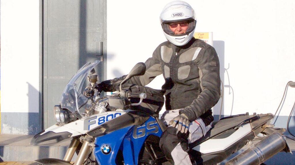 Stephen Scourfield during the motorcycling days in Oman.Picture: Supplied